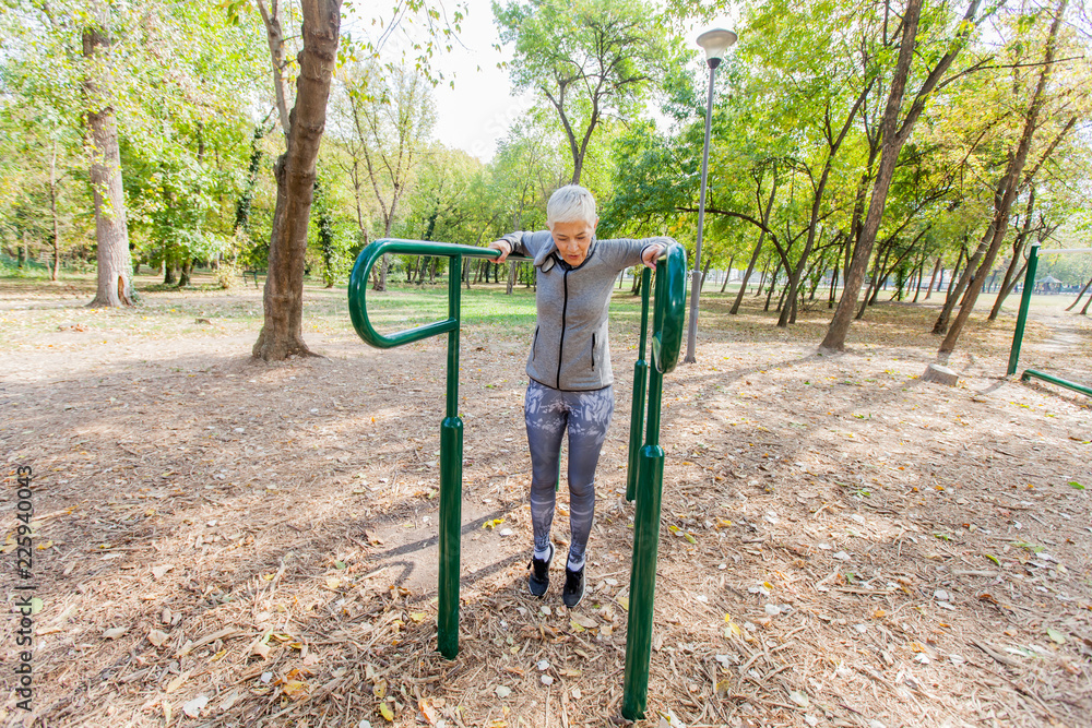 Active Senior Woman Exercise At Outdoor Gym