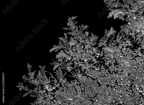 Natural ice crystals frostwork on dark backround. Macro closeup.