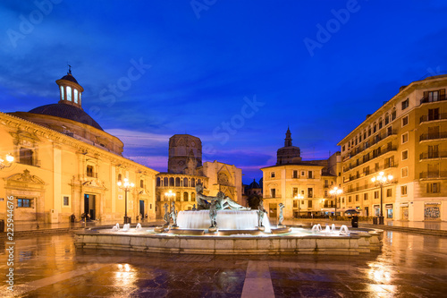 Fountain Rio Turia on Square of the Virgin Saint Mary, Valencia Cathedral, Basilica of Virgen the Helpless at night in Valencia, Spain.. photo