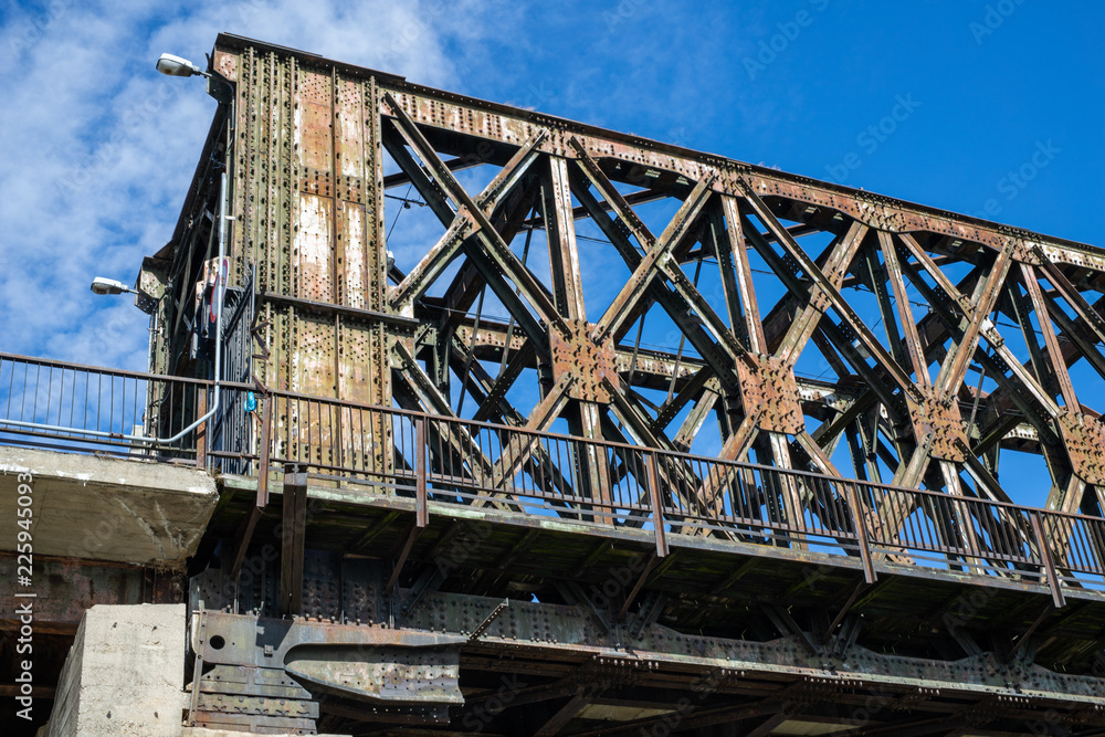 Old railway bridge with pedestrian barriers. Railway bridge over the river. Old railway bridge with pedestrian barriers. Railway bridge over the river.