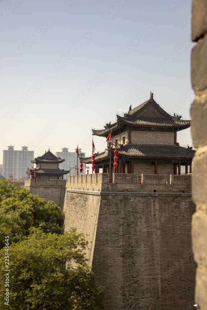 Ancient dity wall with pagodas against modern Xian, China Ancient dity wall with pagodas against modern Xian, China