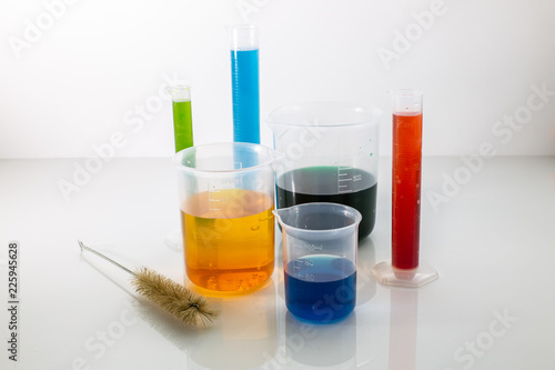 Laboratory glassware with colorful chemical reagent in research laboratory