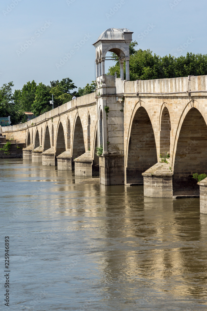 Obraz premium Medieval Bridge from period of Ottoman Empire over Meric River in city of Edirne, East Thrace, Turkey