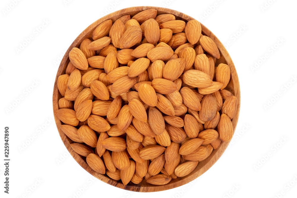 Almonds in wooden dish on white background. Almonds in wooden dish on white background.