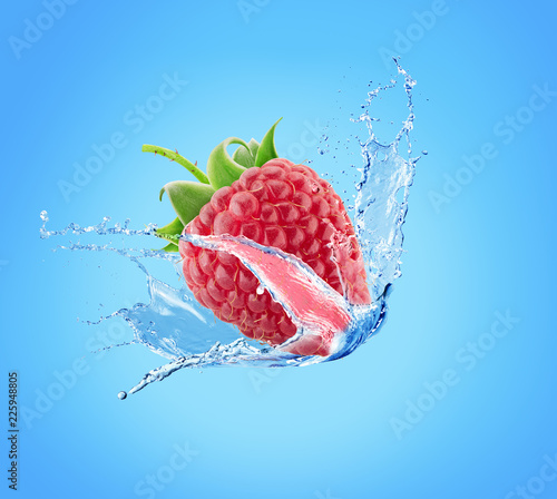 raspberry in water splash on a blue background