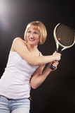 Sport Ideas. Portrait of Happy Smiling Young Caucasian Blond Female Posing With Tennis Racket. Against Black.