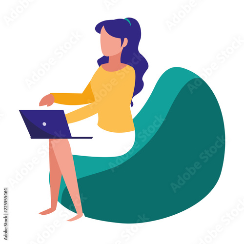 woman with laptop seated in the sofa © djvstock