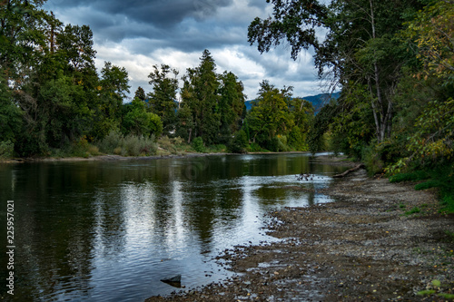 The Rogue River with storm clouds overhead near Grant's Pass, Oregon