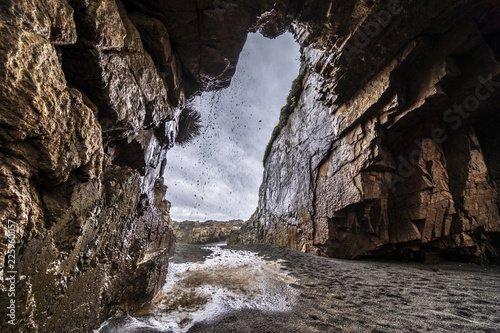 The famous travel destination of  Arcos de Calan   a magical name for a magical place with two natural stone archs in the cliffs over the Pacific Ocean. Mysterious place in a dramatical view  Chile