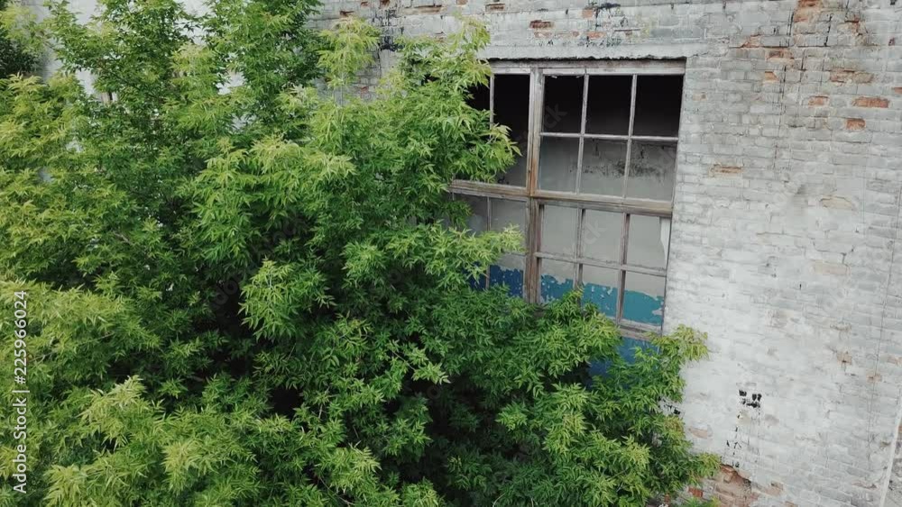 Flying low over abandoned old plant. Ruins of abandoned old broken industrial factory. Flying low over abandoned old plant. Ruins of abandoned old broken industrial factory.