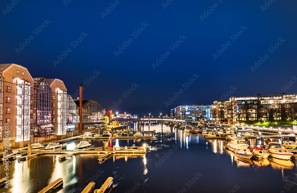 Colorful buildings and hotels and  the Nidelva River at 2 am, Trondheim, Norway.