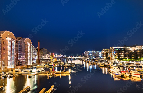 Colorful buildings and hotels and the Nidelva River at 2 am, Trondheim, Norway.