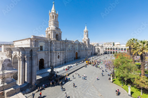 Peru Arequipa basilica cathedral and Arms square gardens in a sunny day with blue sky