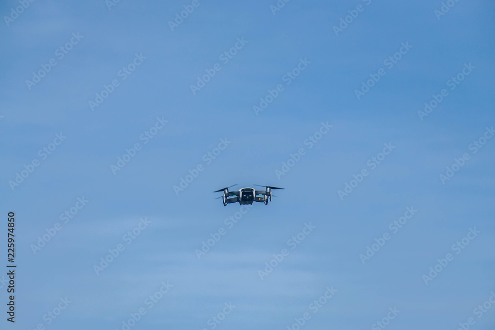 flying drone in the blue sky flying drone in the blue sky