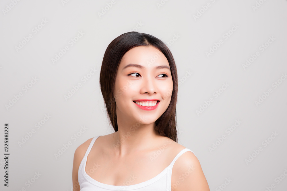 Beautiful diverse woman with gorgeous face, dark luscious hair and glowing skin on her bare shoulders Beautiful diverse woman with gorgeous face, dark luscious hair and glowing skin on her bare shoulders