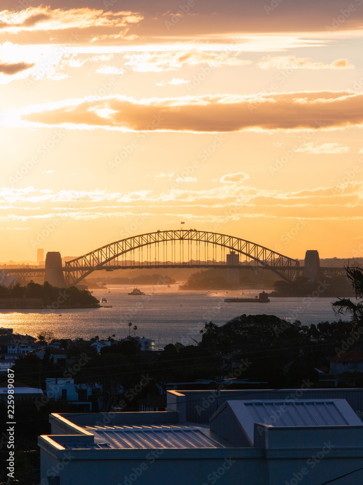 Naklejka premium Sydney Harbour Bridge under the sunset light.
