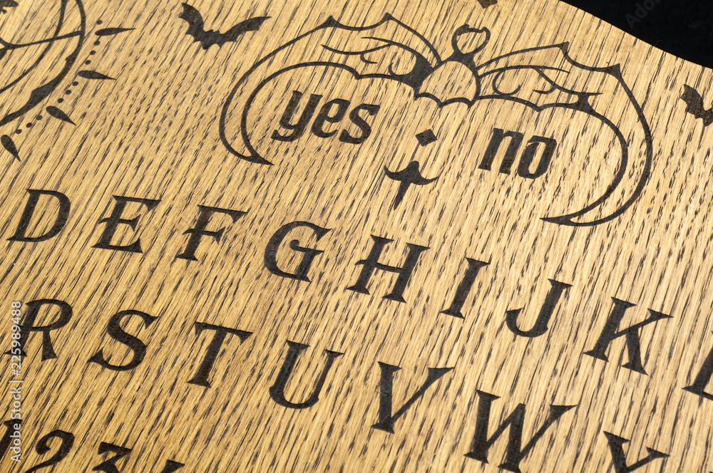 Ouija Board, yellow on a black background Ouija Board, yellow on a black background