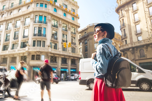 Tourism in Europe, woman tourist with backpack on the street of Barcelona