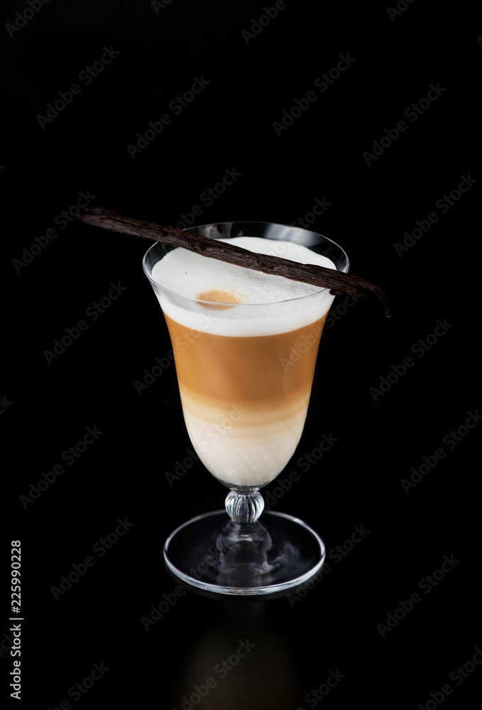 cup cappuccino coffee with vanilla pods on a black background cup cappuccino coffee with vanilla pods on a black background