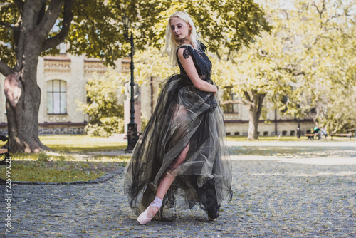 Halloween party concept, mysterious girl in black lace handmade dress . Beautiful young woman. Inspiration for halloween celebration, ideas and simple nice detail  photo