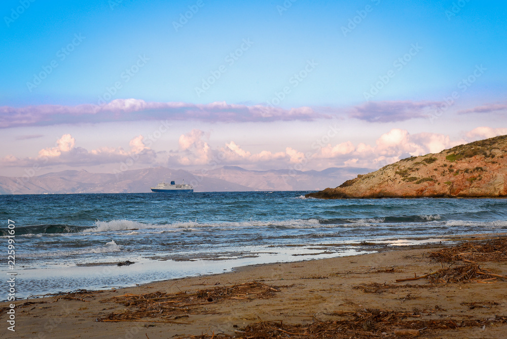 Large blue-white ferry ship leaving port of Rafina on a winter day
