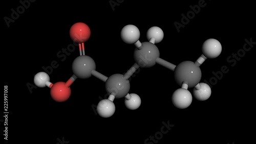 butyric acid molecule model rotating. Butyric acid is found in milk, especially goat, sheep and buffalo milk, butter. Butyric acid is present in  human vomit and has an unpleasent smell. photo