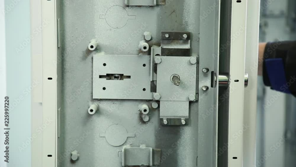 Locking mechanism of the safe. Check of the locking mechanism of the safe. The mechanism is checked for closing opening. Large shot. Locking mechanism of the safe. Check of the locking mechanism of the safe. The mechanism is checked for closing opening. Large shot.