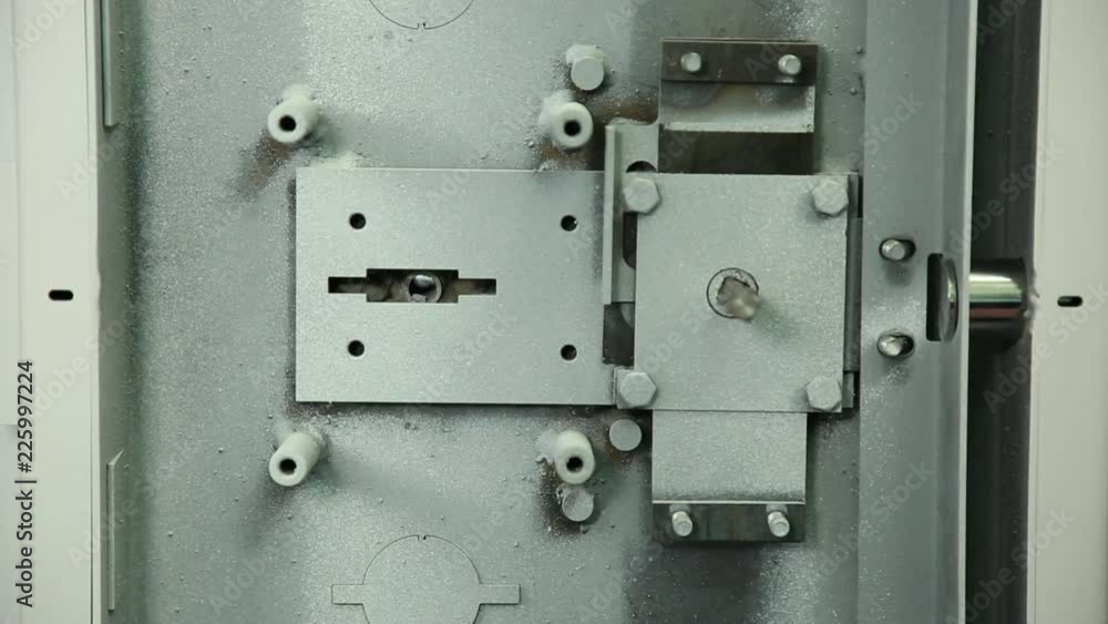 Locking mechanism of the safe. Check of the locking mechanism of the safe. The mechanism is checked for closing opening. Large shot. Locking mechanism of the safe. Check of the locking mechanism of the safe. The mechanism is checked for closing opening. Large shot.