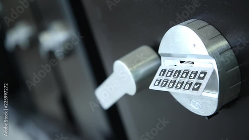 Doors of safes and coded locks. Several safes in a row. Showroom. Safes of black color. Shooting through refocus. Large shot.