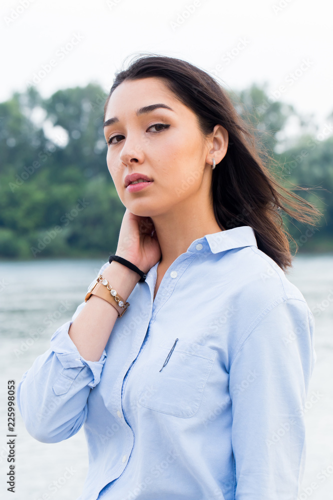 Close-up portrait of attractive young business woman on nature background Close-up portrait of attractive young business woman on nature background