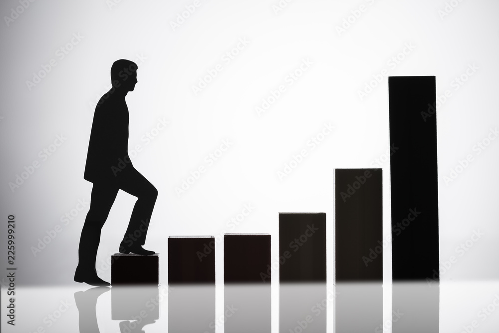 Businessperson Walking On Growing Graph Businessperson Walking On Growing Graph