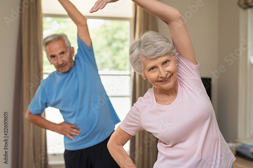 Senior couple doing stretching exercise