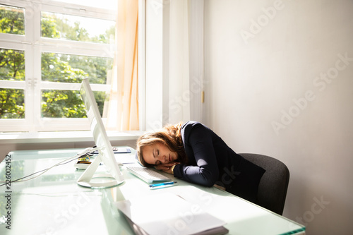 Businesswoman Sleeping In Office