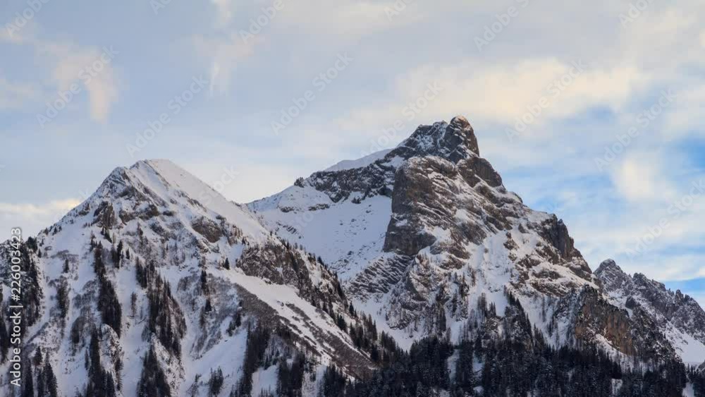 Beautiful 4k UHD timelapse video of the clouds at the mountain tops in the Brandnertal in the Alps in Vorarlberg, Austria, in winter with snow Beautiful 4k UHD timelapse video of the clouds at the mountain tops in the Brandnertal in the Alps in Vorarlberg, Austria, in winter with snow