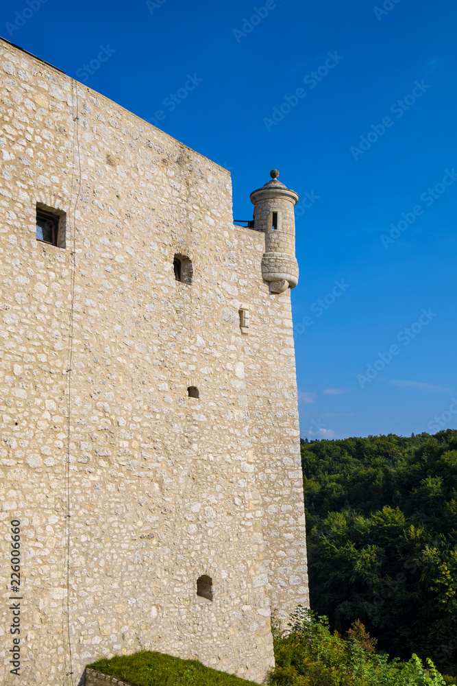 Pieskowa Skala, Poland - Defense wall and keeps of historic castle Pieskowa Skala by the Pradnik river in the Ojcowski National Park