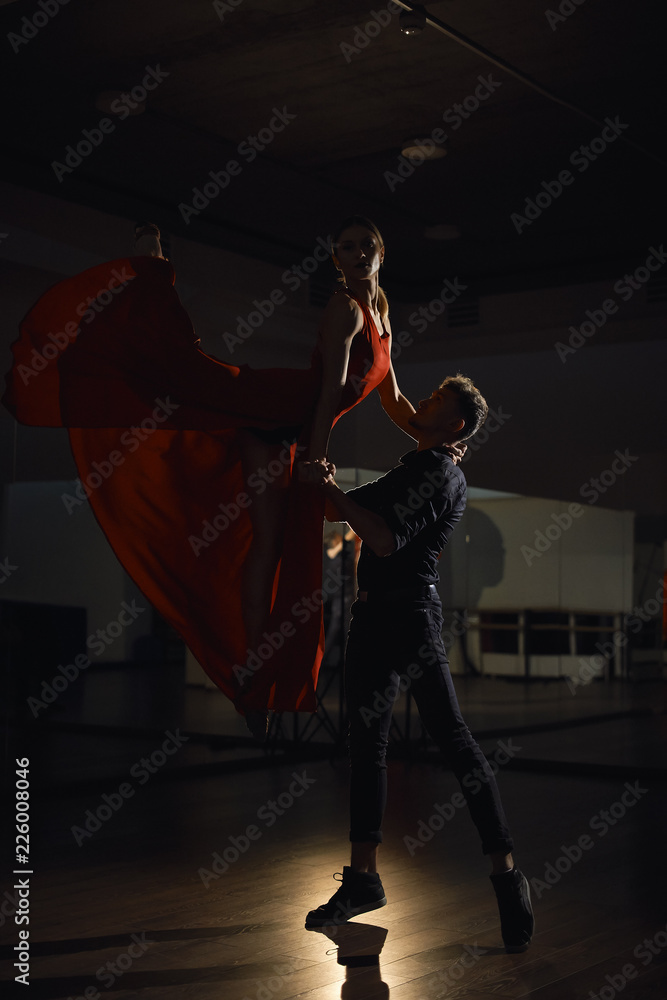Naklejka premium Passion dance couple, woman jumping
