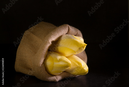 Fotografie organic Belgian endives in a bag