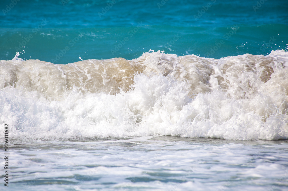 Fototapeta premium Sea wave. The churning of the ocean. Storm waves on the beach.