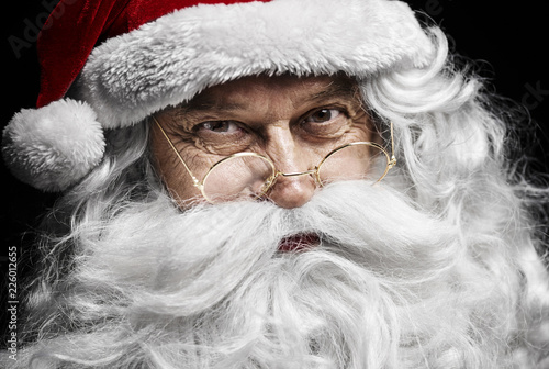 Obraz na plátně Santa claus's human face at studio shot