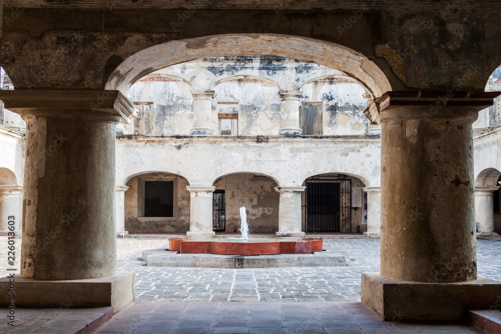 Fountain at the courtyard of Santa Teresa convent in Antigua Guatemala town, Guatemala.