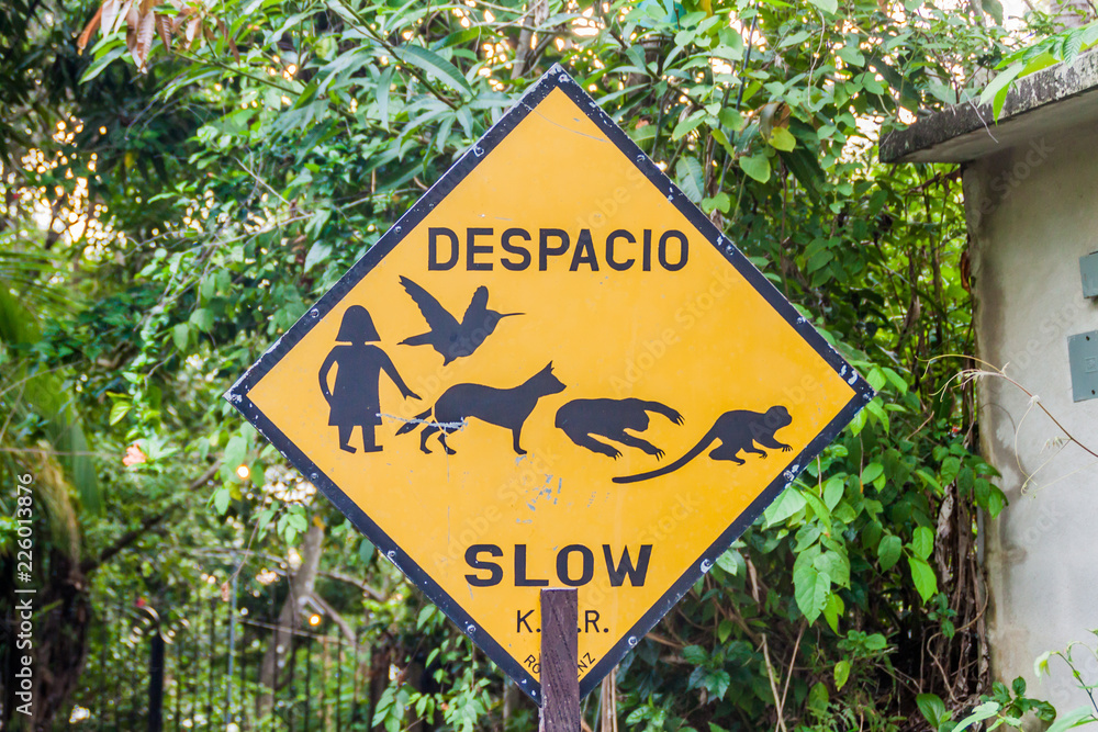 Sign slow in Manuel Antonio village, Costa Rica