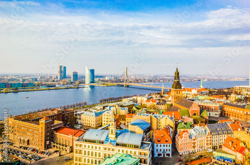 Panoramic view of old town with bright colorful houses and Riga Dome Cathedral  bridge over Dvina river in Riga  Latvia. Beautiful cityscape  top view.