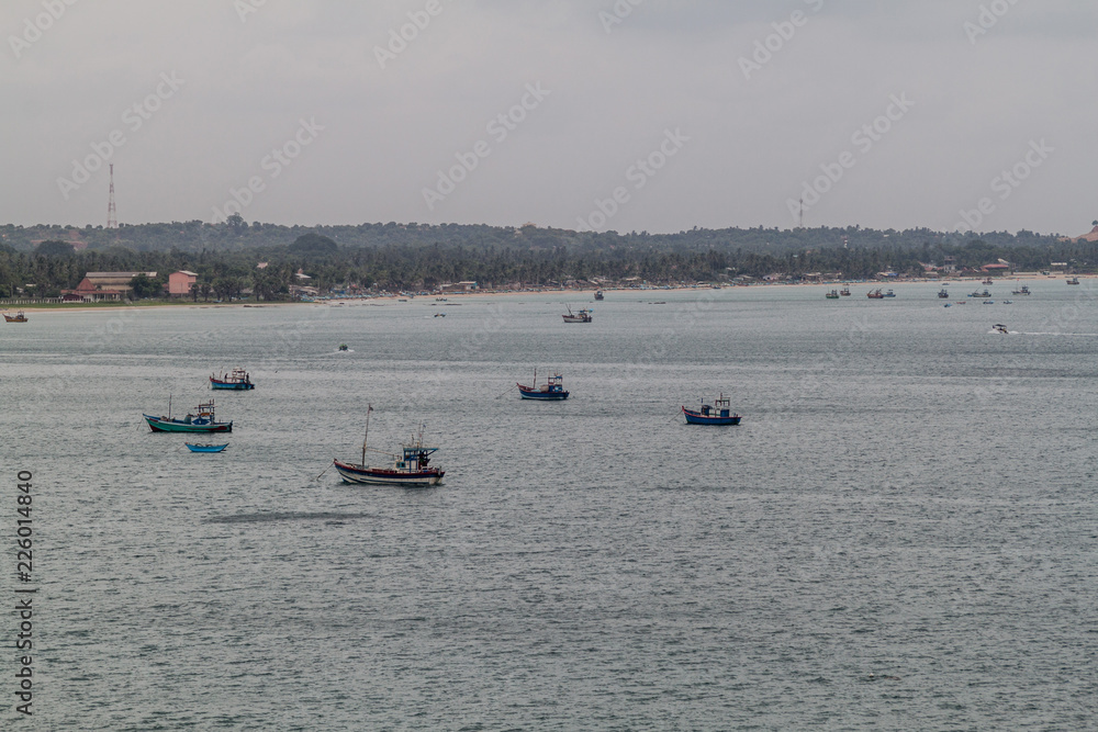 Boats on a sea coast in Trincomalee, Sri Lanka