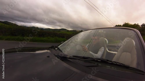 POV shot of a man driving a sports car