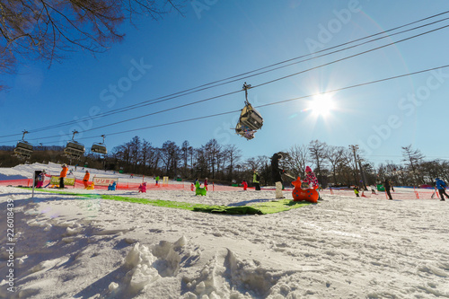 Karuizawa, JAPAN - June 8, 2018:People to play ski ,snowboard and cable car at ski resort in winter on holiday of Nagano Prefecture, Japan.