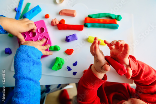 kids play with clay molding shapes, learning through play photo
