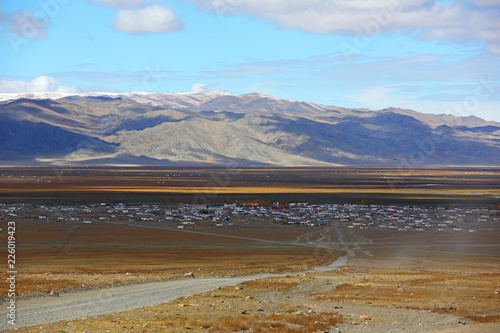 Country village with blue sky over the vast steppes in Western Mongolia