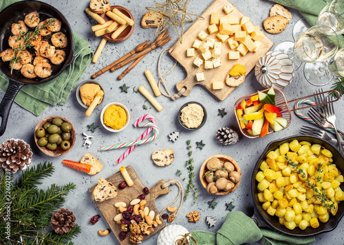 Christmas dinner party table, holiday vegeterian food concept background, top view, flat lay