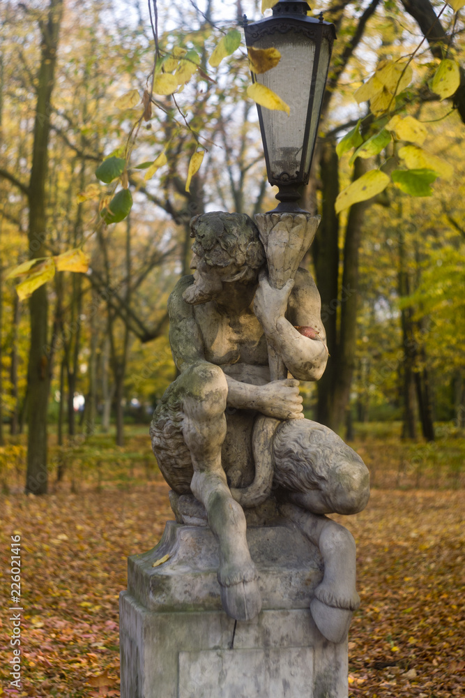 Monuments near lake in national Warsaw park Lazenki Krolewski, Kings bath. 