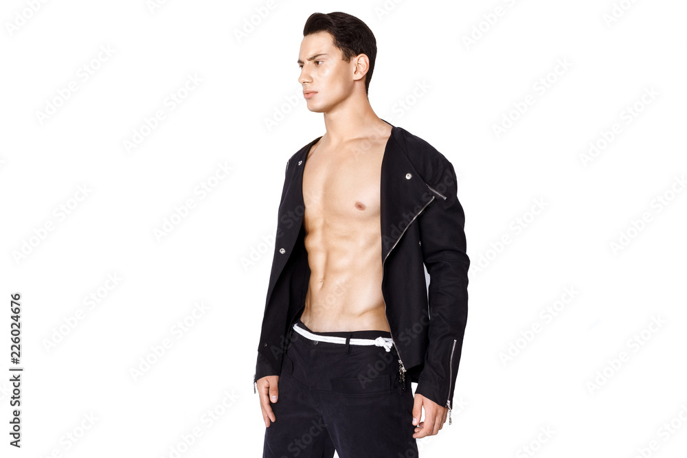 Fototapeta premium Strong muscle beautiful stripped male model in fashion cloathes on white isolated fontk background